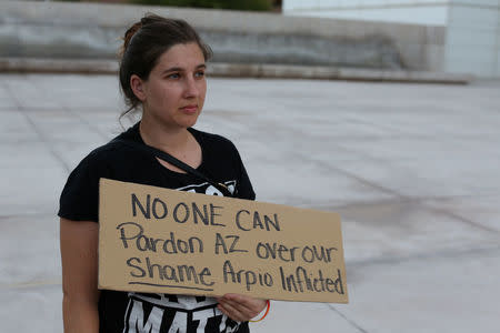 Courtnay Hough protests in Phoenix, Arizona, U.S. August 25, 2017, after former Arizona sheriff Joe Arpaio was pardoned by U.S. President Trump. REUTERS/Caitlin O'Hara