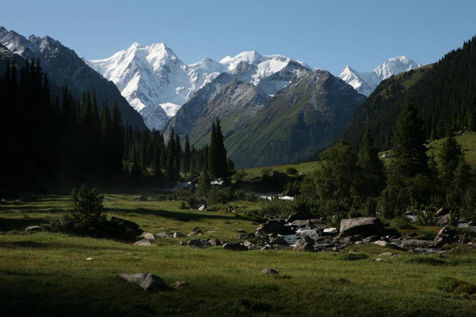 The Terskey Ala-Too mountain range enveloping Kyrgyzstan countryside - Credit: Credit: Vova Pomortzeff / Alamy Stock Photo/Vova Pomortzeff / Alamy Stock Photo