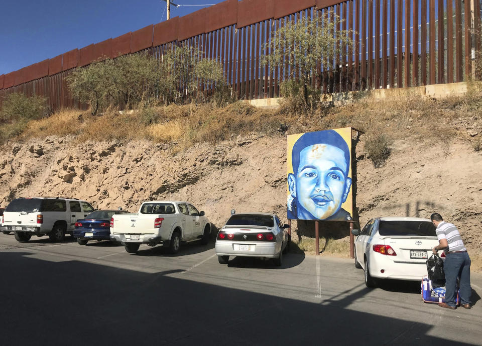 FILE - In this Dec. 4, 2017, file photo, a portrait of 16-year-old Mexican youth Jose Antonio Elena Rodriguez, who was shot and killed in Nogales, Sonora, Mexico, is displayed on the Nogales street where he was killed that runs parallel with the U.S. border. Federal prosecutors on Thursday, Dec. 6, 2018, said they would not pursue another trial against Border Patrol agent Lonnie Swartz, who fatally shot the Mexican teenager but who was twice acquitted. (AP Photo/Anita Snow, File)