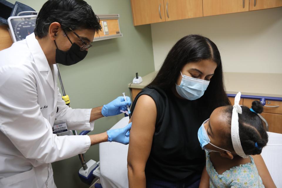Dr. Ashish Parikh gives the second dose of the Monkeypox vaccine to Erica and her daughter Cate 3, at the Summit Health Urgent Care Center in Florham Park, NJ on July 15, 2022.