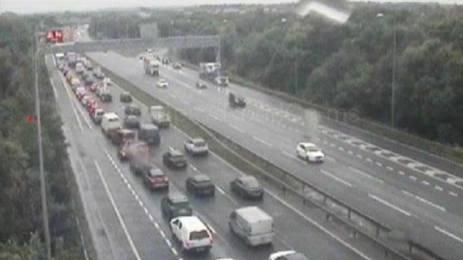 Vehicles queuing on the westbound carriageway of the M62 with cars going back as far as junction 11 at Croft Interchange