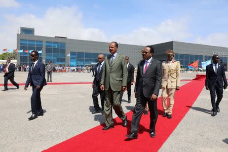 Eritrea's President Isaias Afwerki (L) is welcomed by Somalia's President Mohamed Abdullahi Mohamed as he arrives at the Aden Abdulle International Airport in Mogadishu, Somalia December 13, 2018. REUTERS/Feisal Omar