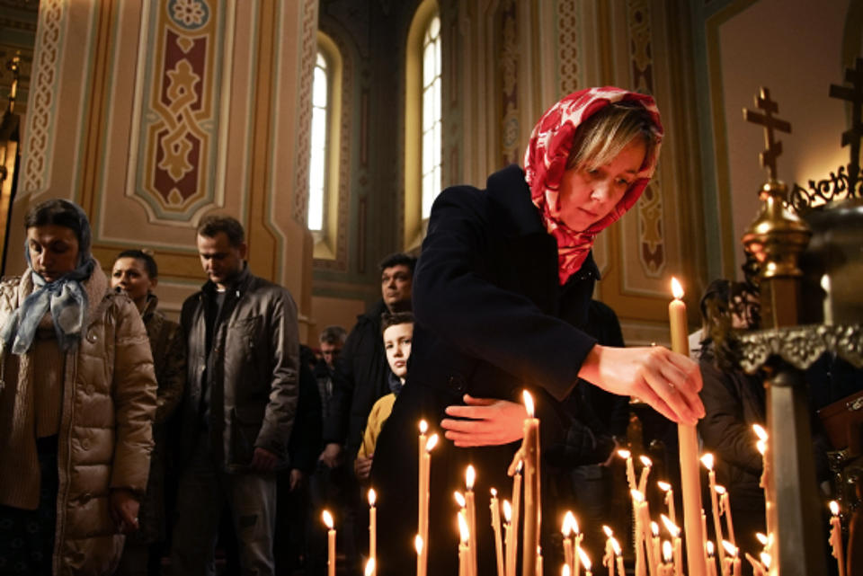 Ukrainians pray at the St. Mary Magdalene Church in Warsaw, Poland on March 10, 2019. Ukrainians prepare to go the polls in a presidential election March 31, as millions of Ukrainians, an estimated one in 10, have already left their country to seek the opportunity of working abroad, as many see no hope if they remain at home. (AP Photo/Mstyslav Chernov)