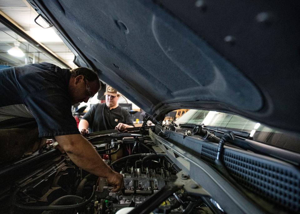 Auto technician, Mitch Lickteig works on  the lifters of  a 2015 GMC Sierra truck  at the Landers Buick GMC in Southaven, MS Saturday, Oct. 11, 2019.