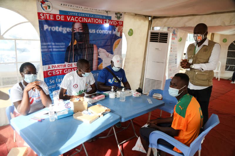 FILE PHOTO: Abidjan soccer fans get the vaccinated against the coronavirus disease (COVID-19) to watch their team play in Abidjan