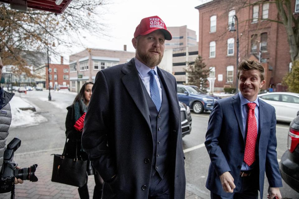 Brad Parscale, campaign manager for President Donald Trump, center, wears a red had that reads "Keep N.H. Great" as he arrives to speak on SiriusXM Satellite Radio at the Red Arrow Diner, Tuesday, Feb. 11, 2020, in Manchester, N.H. (AP Photo/Andrew Harnik)