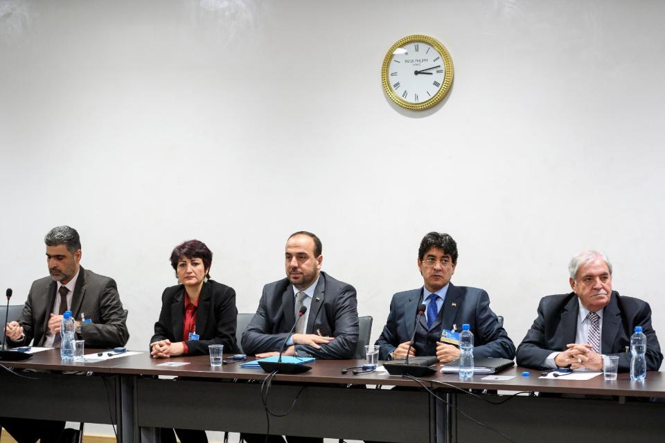 Syria's main opposition delegation with High Negotiations Committee, HNC, leader Nasr al-Hariri, center, attend a meeting with United Nations special envoy for Syria Staffan de Mistura during Syria peace talks in Geneva, Switzerland, Monday, Feb. 27, 2017. (Fabrice CoffriniPool Photo via AP)