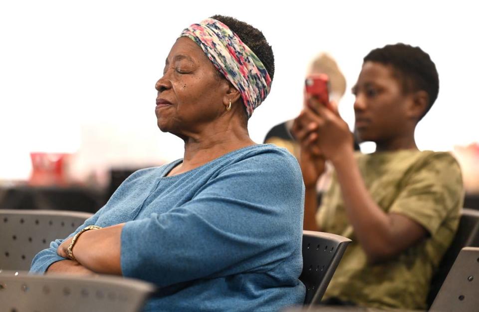 Audience members enjoy the music of the band A Sign of the Times at the West Boulevard Library in Charlotte.