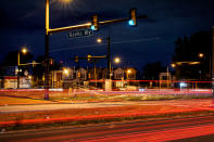 This long exposure photo shows traffic driving on Roosevelt Boulevard at Banks Way, named for Samara Banks and her three children who were struck and killed by a car in 2013, in Philadelphia, Wednesday, May 25, 2022. (AP Photo/Matt Rourke)