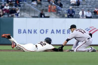 San Francisco Giants' Jason Vosler, left, is tagged out at second base by Arizona Diamondbacks shortstop Nick Ahmed on a double play hit into by Giants' LaMonte Wade Jr. during the second inning of a baseball game in San Francisco, Monday, June 14, 2021. (AP Photo/Jeff Chiu)