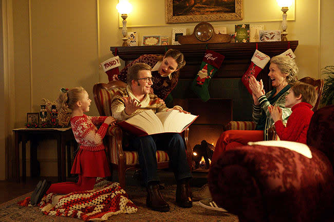 A Christmas Story Christmas cast sit by fire