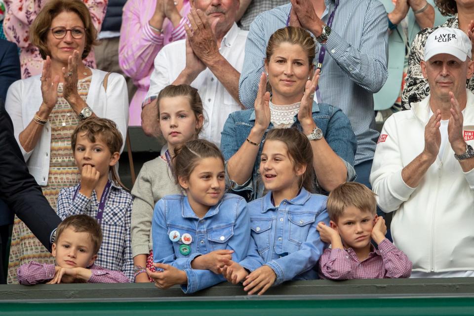 Mirka Federer, wife of Roger Federer with their children nine-year-old twin girls Charlene and Myla and five-year-old boys Lenny and Leo during presentations after Roger Federer of Switzerland loss against Novak Djokovic of Serbia during the Men's Singles Final on Centre Court during the Wimbledon Lawn Tennis Championships at the All England Lawn Tennis and Croquet Club at Wimbledon on July 14, 2019 in London, England.