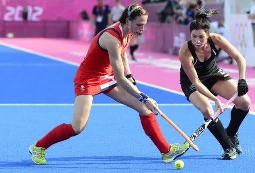 Britain's Kate Walsh (L) is challenged by New Zealand's Cathryn Finlayson during the women's field hockey bronze medal match at The Riverbank Arena in London. Great Britain, inspired by skipper Walsh who broke her jaw just a week ago, beat New Zealand 3-1 to earn an Olympic bronze medal, something they last achieved 20 years ago in Barcelona