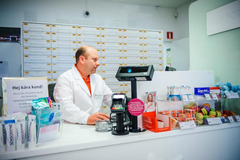 45 year-old George Zedan, pharmacist and refugee from Syria, works as an apprentice at a local pharmacy on a government-funded scheme while he waits for his qualifications to be recognised