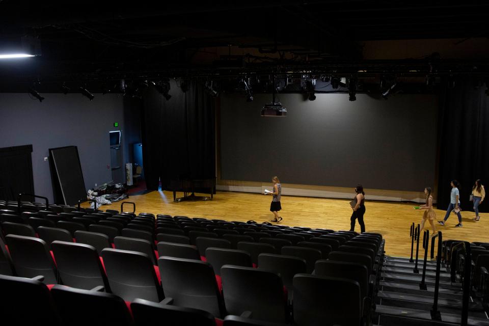 Robin Shuford Frank, the music director, left, and singers walk into the theater during a rehearsal of Opera Naples’ “H.M.S. Pinafore,” by Arthur Sullivan and W.S. Gilbert, Tuesday, June 14, 2022, at the Wang Opera Center in Naples, Fla.