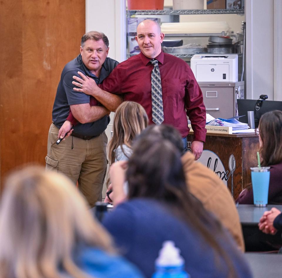 Trainer Mike Anders, left, works with a group of Visalia Unified employees Tuesday, January 31, 2023 at Mt. Whitney High School. The district is providing ALICE training to employees as preparation for an active shooter.