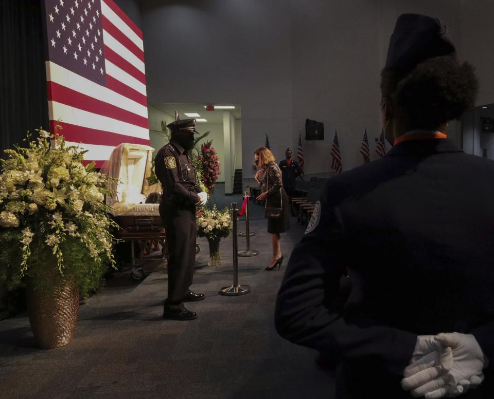 Honor guards stand at attention near Carrie Meek's open casket as members of the community attend the viewing ceremony at Booker T. Washington in Miami, Fla., Sunday, Dec. 5, 2021. (Carl Juste/Miami Herald via AP)