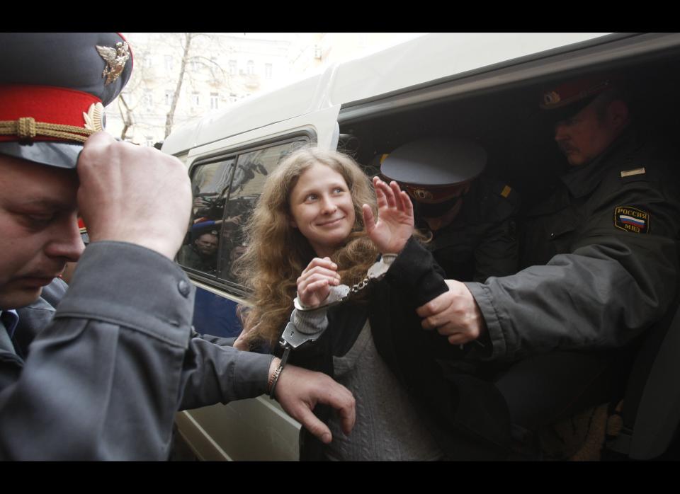 Maria Alyokhina of Pussy Riot is escorted to a courtroom in Moscow, Russia.