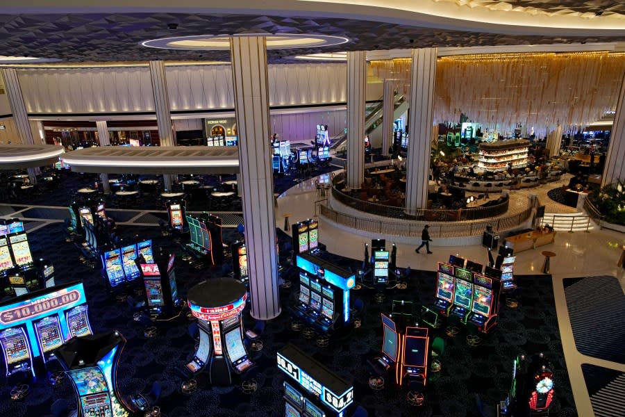 P<em>eople walk through the casino area at the Fontainebleau Las Vegas hotel-casino Tuesday, Dec. 12, 2023, in Las Vegas. The property is scheduled to open Wednesday. (AP Photo/John Locher)</em>