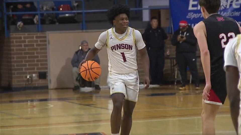 PHOTO: Pinson Valley High School basketball player Caleb White dribbles the ball during a game. (WBMA)