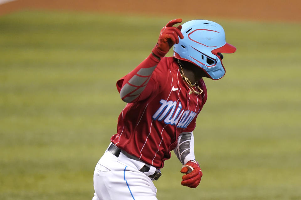 Miami Marlins' Jazz Chisholm Jr. reacts after hitting an RBI-single to score Garrett Cooper during the second inning of a baseball game against the New York Mets, Sunday, May 23, 2021, in Miami. (AP Photo/Lynne Sladky)