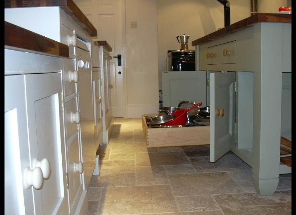 Pull-out drawers can hide unsightly appliances and clutter. Not to mention it'll be less straining on your back when it's time to reach for an item. See the full tutorial at <a href="http://www.thisoldhouse.com/toh/how-to/intro/0,,709890,00.html" target="_hplink">This Old House</a>.    Flickr photo by <a href="http://www.flickr.com/photos/pflintandco/5890994156/" target="_hplink">Paul Flint & Company </a>
