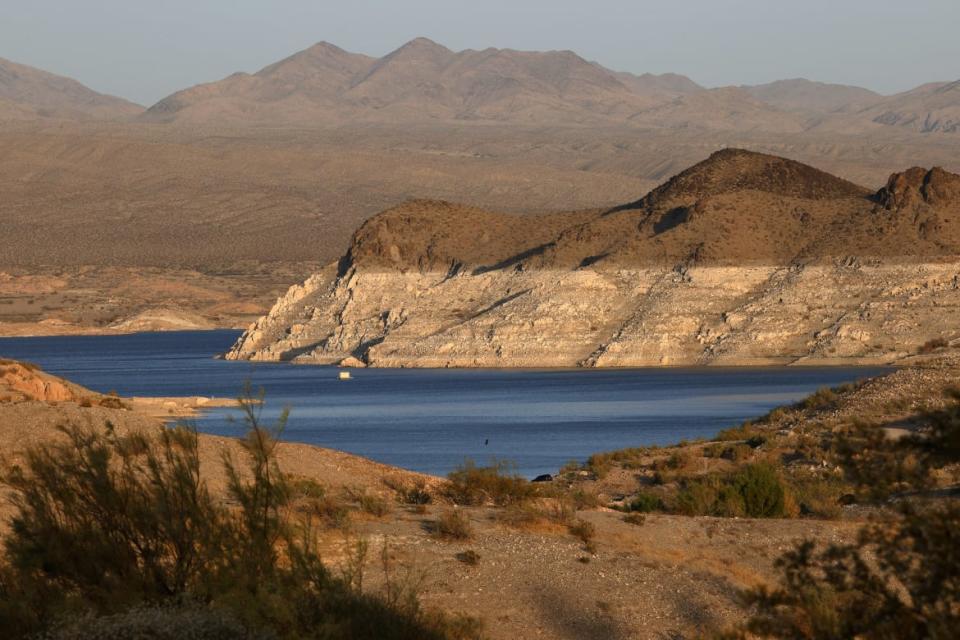 <div class="inline-image__caption"><p>Mineral-stained rocks are shown at Echo Bay on June 21, 2021 in the Lake Mead National Recreation Area, Nevada. The U.S. Bureau of Reclamation reported that Lake Mead, North America's largest artificial reservoir, dropped to just over 1,070 feet above sea level over the weekend, the lowest it's been since being filled in 1937 after the construction of the Hoover Dam.</p></div> <div class="inline-image__credit"> Ethan Miller/Getty</div>