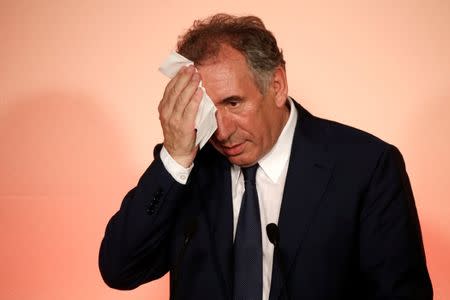 MoDem leader Francois Bayrou, outgoing Justice Minister, wipes his face during a news conference in Paris, France, June 21, 2017. REUTERS/Charles Platiau