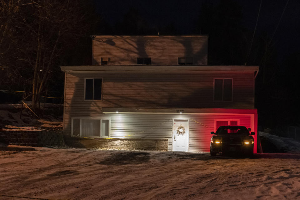 A private security officer sits in a vehicle, Tuesday, Jan. 3, 2023, in front of the house in Moscow, Idaho where four University of Idaho students were killed in November, 2022. Authorities said Wednesday, Jan. 4, that Bryan Kohberger, the man accused in the killings, has left a Pennsylvania jail in the custody of state police. The move means Kohberger could be headed to Idaho to face first-degree murder charges. (AP Photo/Ted S. Warren)