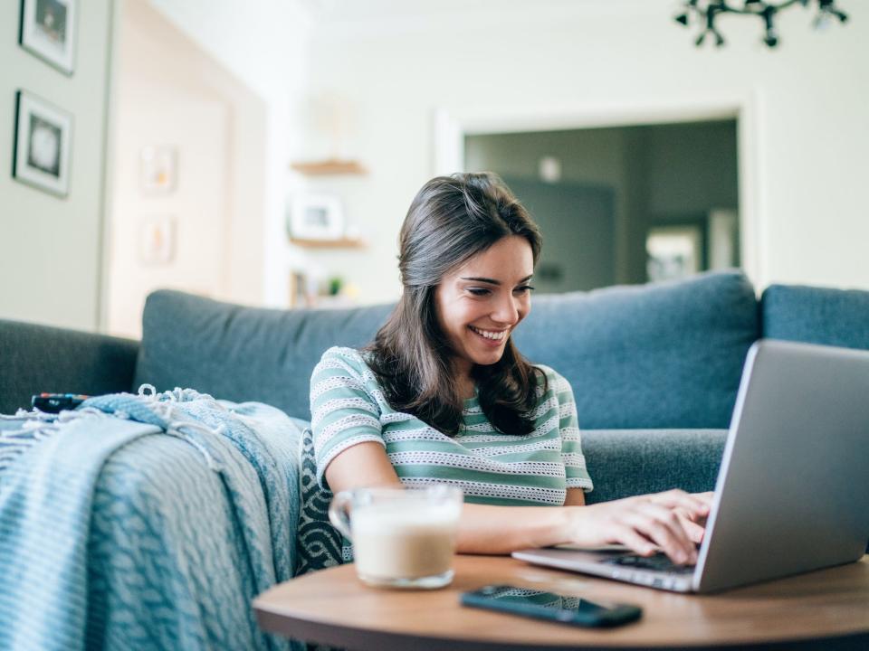 Woman using a laptop at home