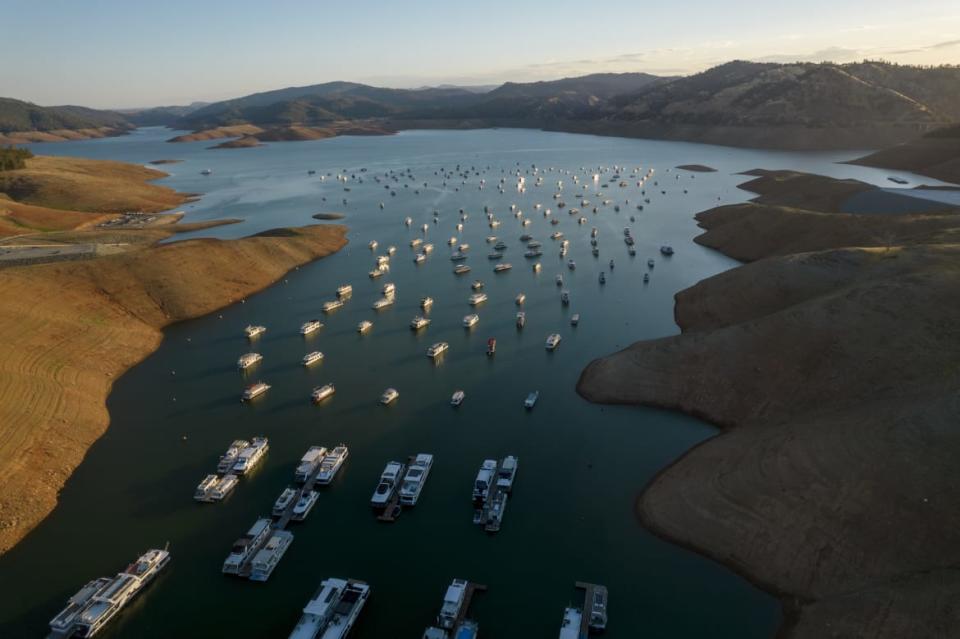 <div class="inline-image__caption"><p>Steep banks surround boats on Oroville Lake during low water levels in Oroville, California, U.S., on Tuesday, June 22, 2021. </p></div> <div class="inline-image__credit">Kyle Grillot/Bloomberg via Getty</div>