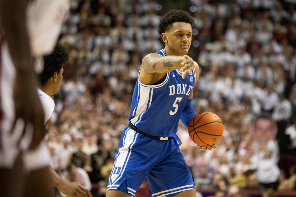 Duke forward Paolo Banchero (5) directs the offense against Florida State in the first half of a NCAA college basketball game in Tallahassee, Fla., Tuesday Jan. 18, 2022. (AP Photo/Mark Wallheiser)