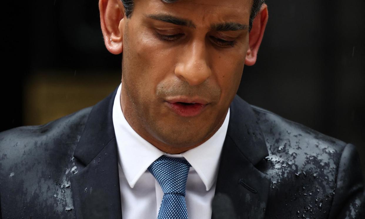 <span>Rishi Sunak got soaked in a heavy downpour on 22 May, when he announced the date of the next UK general election.</span><span>Photograph: Henry Nicholls/AFP/Getty</span>