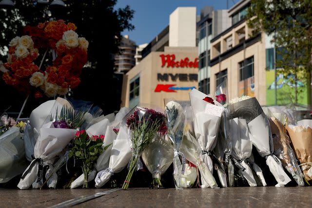 <p>Brendon Thorne/Getty Images</p> Flowers placed outside the Bondi Junction Westfield Shopping Centre