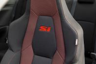 <p>The same seats from the 2019 Civic Si are now trimmed in red to match the stitching and the rest of the red in the interior cabin. They're not as bolstered as the Type R's seats, the Si's seats provide extreme comfort and enough bolstering to keep you in the seat when driving spiritedly. We really appreciate the newly added red touches.</p>