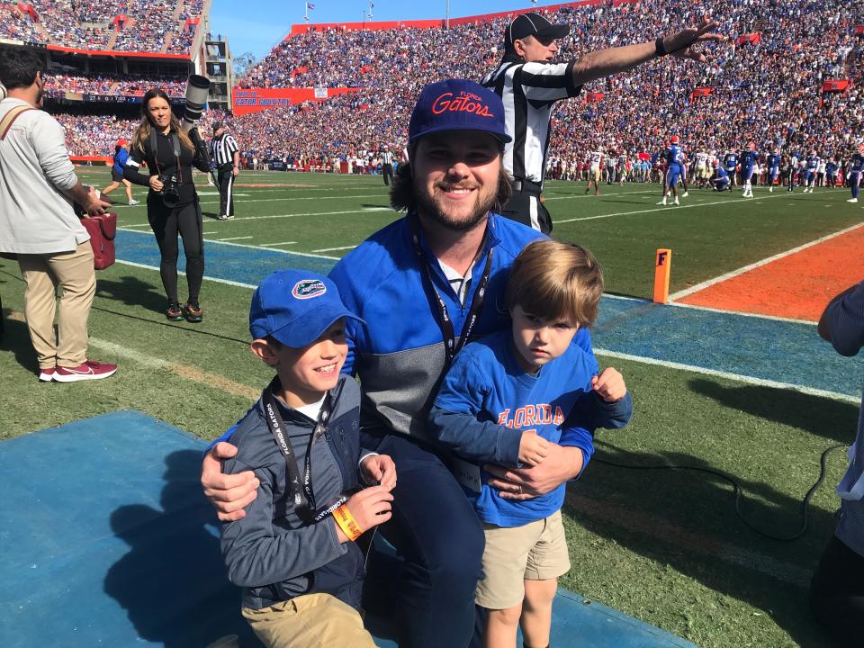 Author Chris Corr (center) is shown with his son, Thomas (right) and nephew Joshua, on the sidelines at Ben Hill Griffin Stadium in Gainesville, when the UF Gators defeated the Florida State Seminoles 24-21 on Nov. 27, 2021.