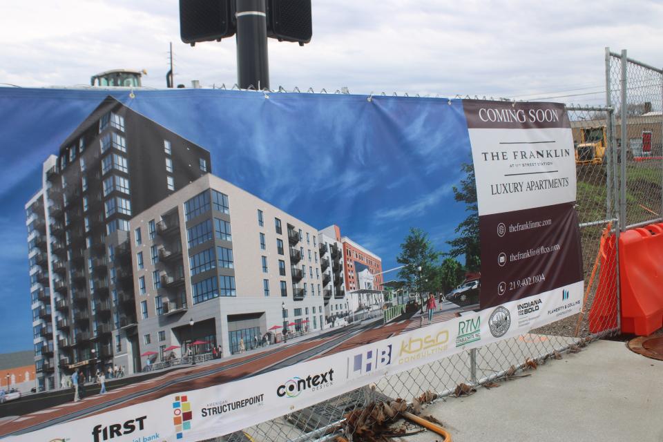 This banner shows an artist's rendering of The Franklin at 11th Street Station, a 12-story apartment tower being built next to the new South Shore Line commuter train station in Michigan City.
