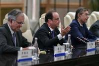 French President Francois Hollande (C) speaks during his meeting with Chinese President Xi Jinping (not pictured) at the West Lake State House on the sidelines of the G20 Summit, in Hangzhou, Zhejiang province, China, September 5, 2016. REUTERS/Etienne Oliveau/Pool