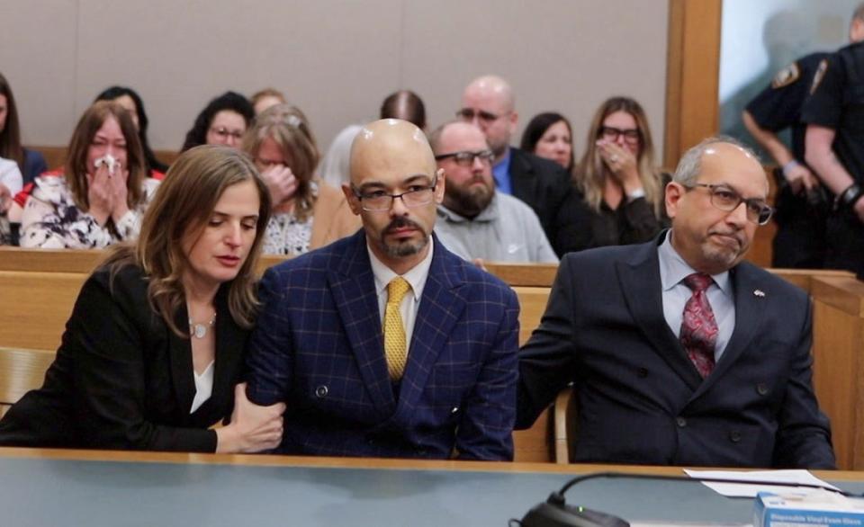 Andrew Krivak, surrounded by his attorneys, listens as a jury acquits him for the rape and murder of 12-year-old Josette Wright in Putnam Court on Feb. 27. Krivak was re-tried after a judge overturned the original convictions, for which he spent 24 years in prison.