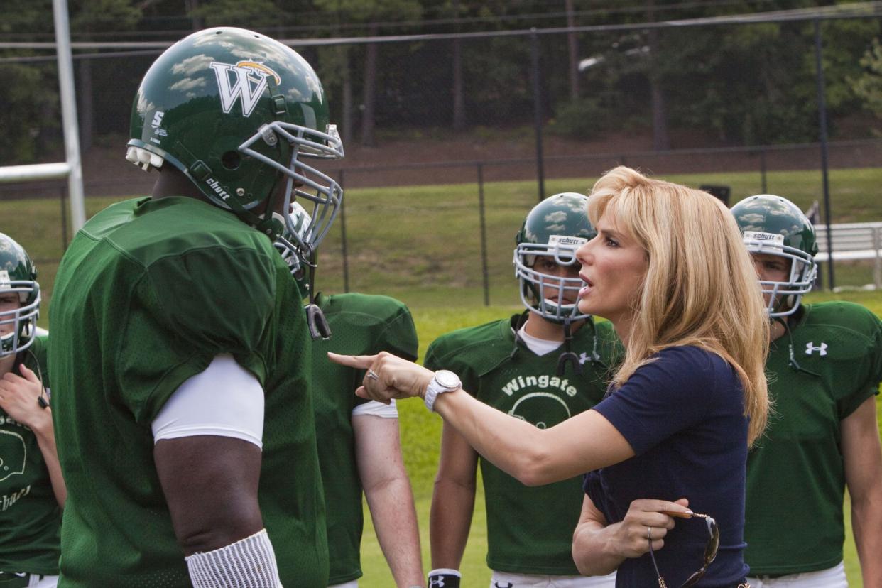 Quinton Aaron as Michael Oher and Sandra Bullock as Leigh Anne Tuohy in Alcon Entertainment's drama "The Blind Side."