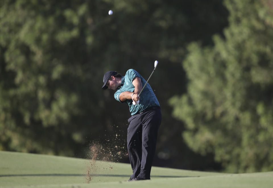 Patrick Reed from the U.S. plays a shot on the 16th hole during the first round of the DP World Tour Championship golf tournament in Dubai, United Arab Emirates, Thursday, Nov. 15, 2018. (AP Photo/Kamran Jebreili)