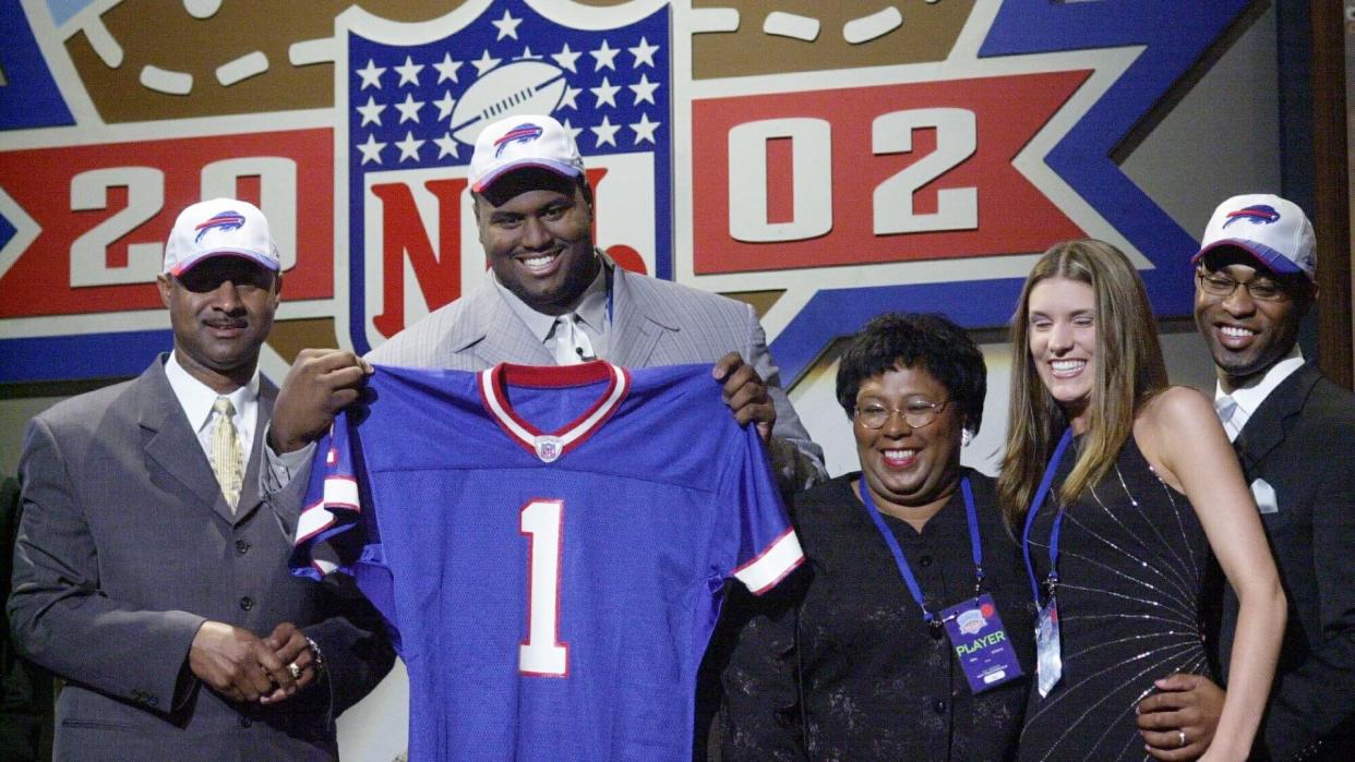 Mandatory Credit: Photo by Mark Lennihan/AP/Shutterstock (6032802a)WILLIAMS Mike Williams, an offensive tackle from Texas, is joined on stage by family after being selected as the fourth pick overall in the first round by the Buffalo Bills of the 2002 NFL Draft in New York .