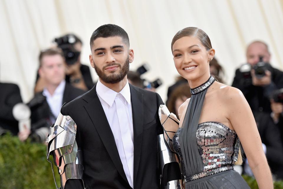 Zayn Malik and Gigi Hadid pose in formal attire at the Metropolitan Museum of Art.