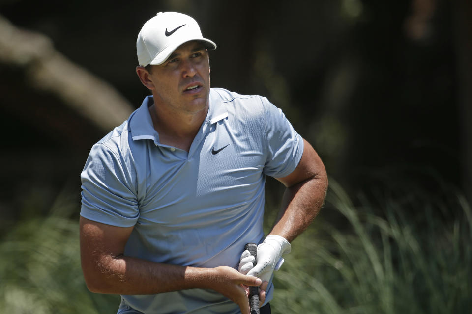 Brooks Koepka watches his shot off the second tee during the final round of the RBC Heritage golf tournament, Sunday, June 21, 2020, in Hilton Head Island, S.C. (AP Photo/Gerry Broome)