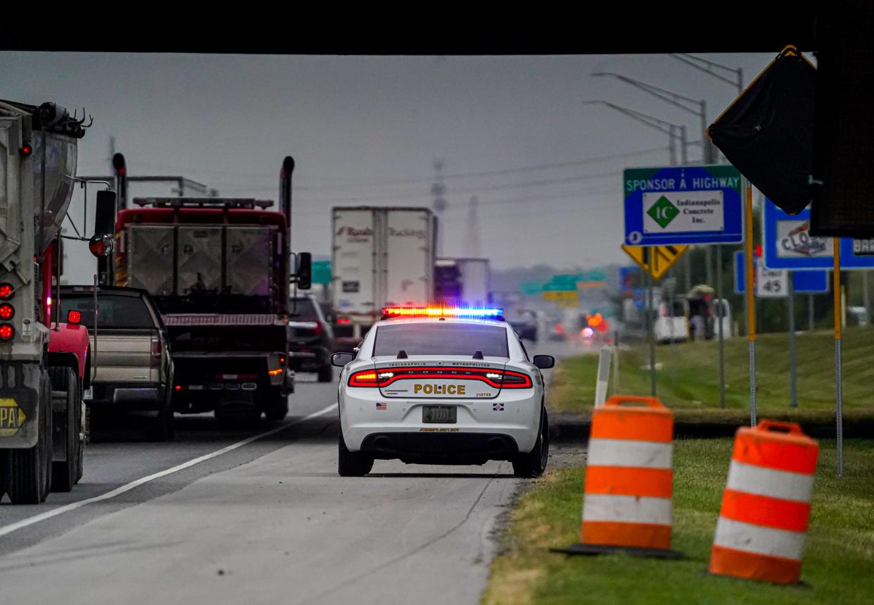 An IMPD car monitors traffic in a construction zone along I-69 s. on Thursday, Oct. 5, 2023, in Ind.