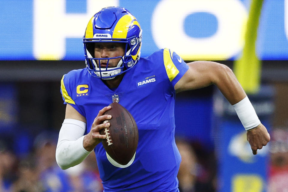 INGLEWOOD, CALIFORNIA - JANUARY 30: Matthew Stafford #9 of the Super Bowl-bound Los Angeles Rams runs with the ball in the NFC Championship Game against the San Francisco 49ers at SoFi Stadium on January 30, 2022 in Inglewood, California. (Photo by Ronald Martinez/Getty Images)