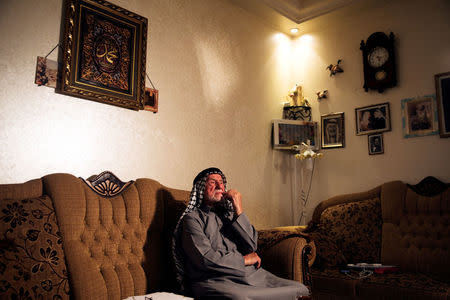 FILE PHOTO: Mohammad Mahmoud Jadallah, a 96-year-old Palestinian from Sur Baher, a village in the suburbs of Arab east Jerusalem, sits in his house during an interview, May 8, 2018. REUTERS/Ronen Zvulun/File Photo