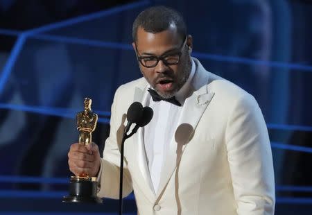 90th Academy Awards - Oscars Show - Hollywood, California, U.S., 04/03/2018 - Jordan Peele accepts the Oscar for Best Original Screenplay for "Get Out." REUTERS/Lucas Jackson