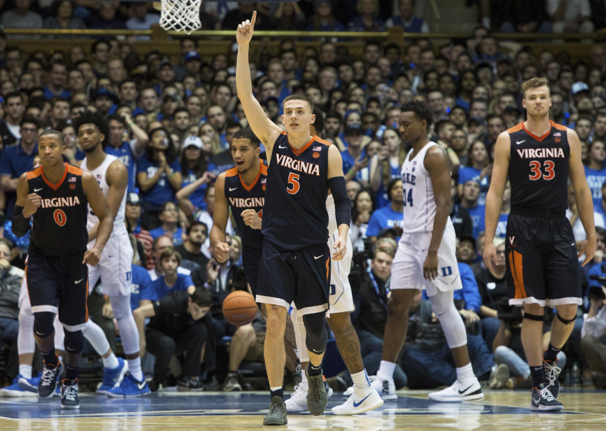 Virginia’s Kyle Guy (5) leads his team off the court following a 65-63 victory over Duke in an NCAA college basketball game against Duke in Durham, N.C., Saturday, Jan. 27, 2018. (AP Photo/Ben McKeown)