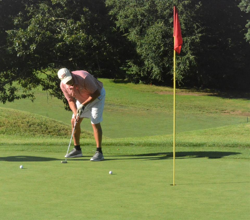 Norwich's Vin Cirillo rolls in a putt on the 13th hole at Norwich Golf Course.